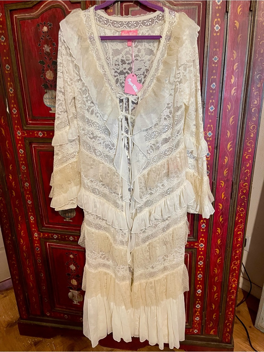 Sugar Thrillz Lace trench with tie closures.